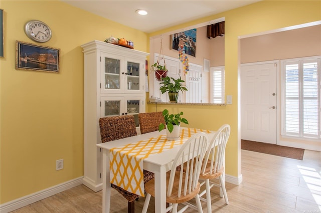 60 Erin Ln Unit 60, East Setauket, NY 11733 - dining area with light wood finished floors and recessed lighting
