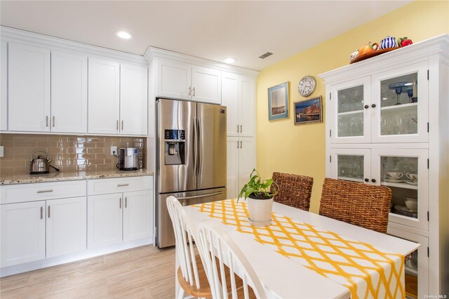 60 Erin Ln Unit 60, East Setauket, NY 11733 - dining area with light wood finished floors and recessed lighting