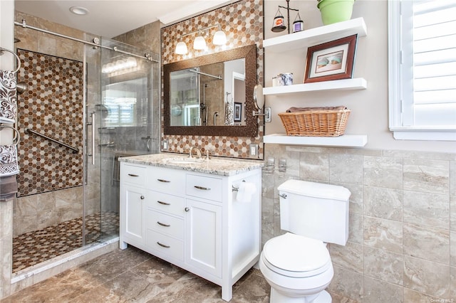 60 Erin Ln Unit 60, East Setauket, NY 11733 - bathroom with tile walls, vanity, and a stall shower