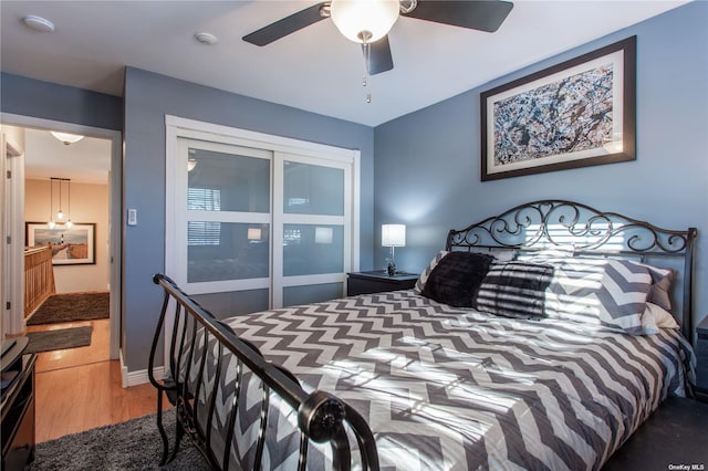 60 Erin Ln Unit 60, East Setauket, NY 11733 - bedroom with wood finished floors, a ceiling fan, and a closet