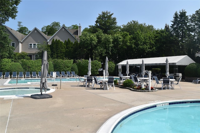 60 Erin Ln Unit 60, East Setauket, NY 11733 - community pool featuring a patio area