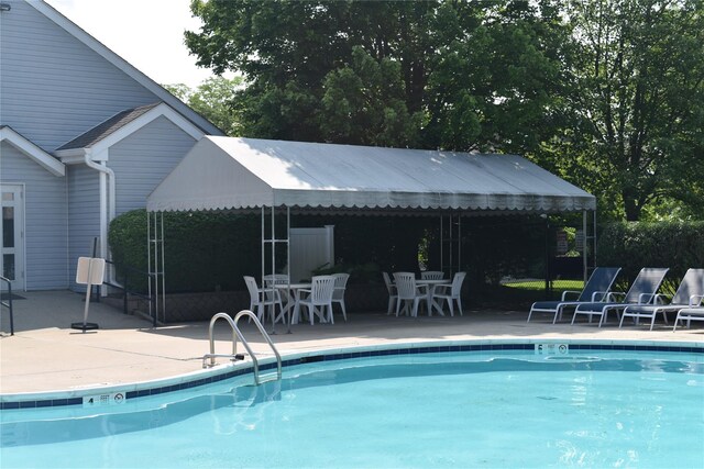 60 Erin Ln Unit 60, East Setauket, NY 11733 - community pool featuring a patio
