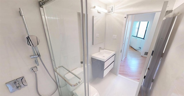 2 Bay Club Dr Unit 6Z4, Bayside, NY 11360 - bathroom featuring vanity, a stall shower, and wood finished floors