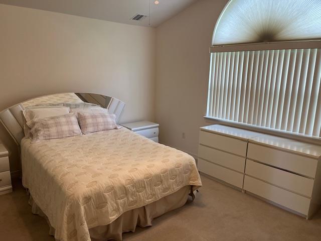 703 Pebble Beach Path, Riverhead, NY 11901 - bedroom with light colored carpet