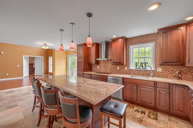 kitchen with wall chimney exhaust hood, dishwasher, black electric stovetop, decorative backsplash, and a kitchen island