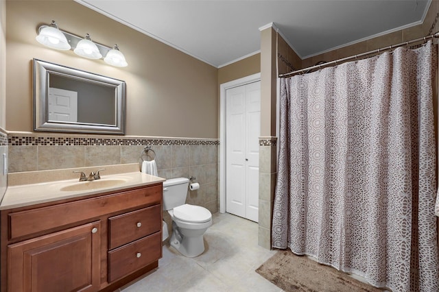 full bathroom with vanity, ornamental molding, tile patterned floors, toilet, and tile walls