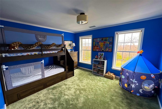 bedroom featuring crown molding, visible vents, carpet flooring, and baseboards