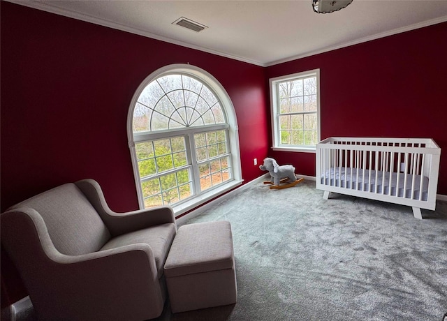 bedroom with crown molding, visible vents, carpet floors, and multiple windows