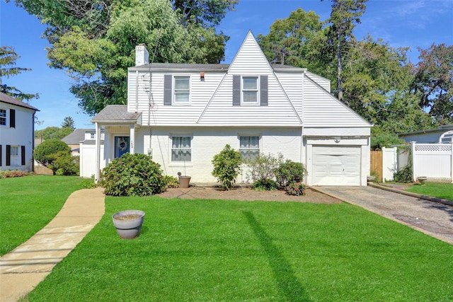 154 California Ave, Freeport, NY 11520 - view of front of house featuring a front yard, an attached garage, a chimney, fence, and driveway