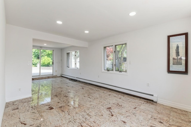 18 Oxford Rd, East Rockaway, NY 11518 - empty room featuring a baseboard heating unit, recessed lighting, and marble finish floors