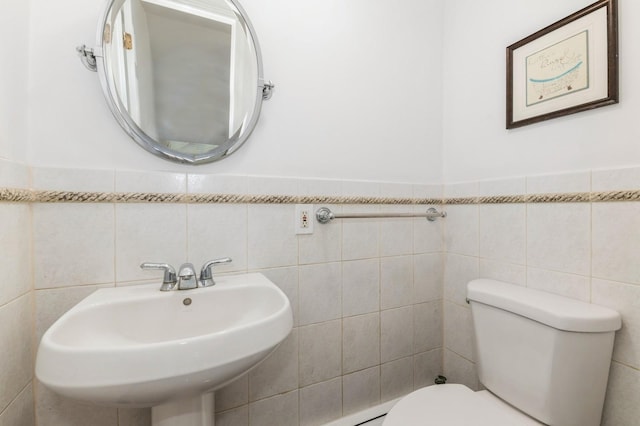 18 Oxford Rd, East Rockaway, NY 11518 - half bathroom featuring tile walls and a sink