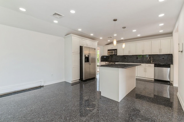 18 Oxford Rd, East Rockaway, NY 11518 - kitchen with stainless steel appliances, granite floors, white cabinetry, and recessed lighting