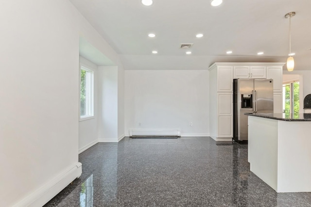 18 Oxford Rd, East Rockaway, NY 11518 - unfurnished living room featuring a baseboard radiator, granite floors, recessed lighting, and healthy amount of natural light