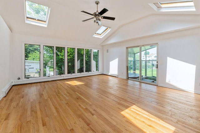 18 Oxford Rd, East Rockaway, NY 11518 - unfurnished living room featuring a skylight, vaulted ceiling, light wood-type flooring, and a ceiling fan