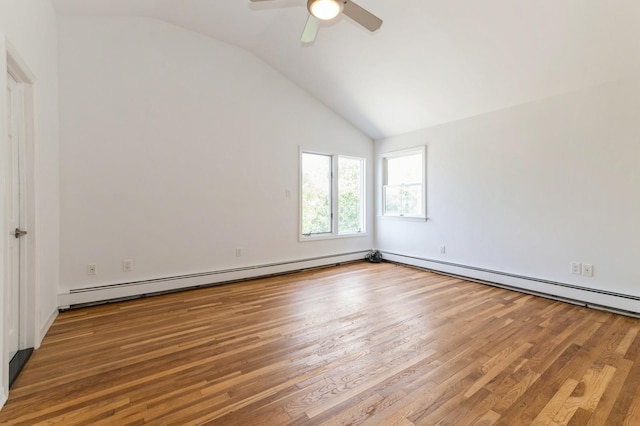 18 Oxford Rd, East Rockaway, NY 11518 - spare room featuring vaulted ceiling, a baseboard radiator, wood finished floors, and ceiling fan