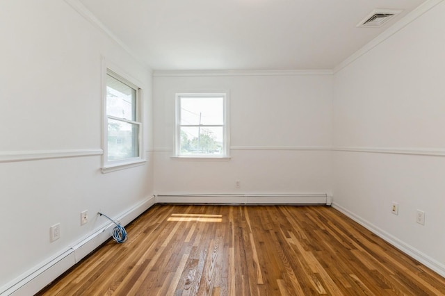 18 Oxford Rd, East Rockaway, NY 11518 - empty room featuring ornamental molding, baseboard heating, and hardwood / wood-style flooring