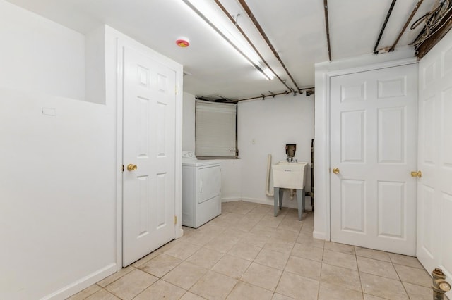 18 Oxford Rd, East Rockaway, NY 11518 - laundry area featuring washer / clothes dryer and light tile patterned floors
