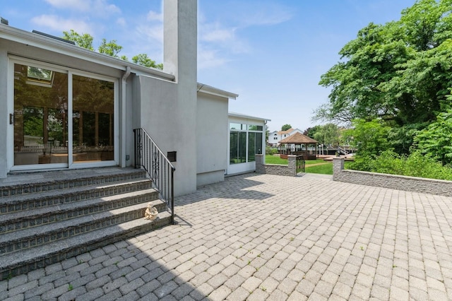 18 Oxford Rd, East Rockaway, NY 11518 - view of patio with entry steps, a gazebo, and a sunroom