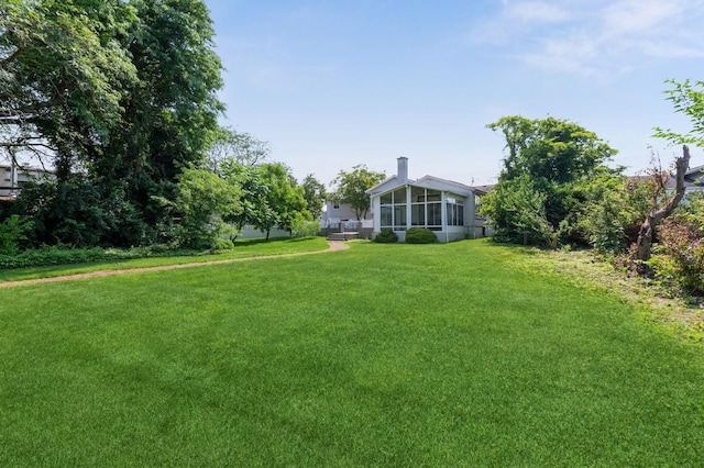 18 Oxford Rd, East Rockaway, NY 11518 - view of grassy yard featuring a sunroom
