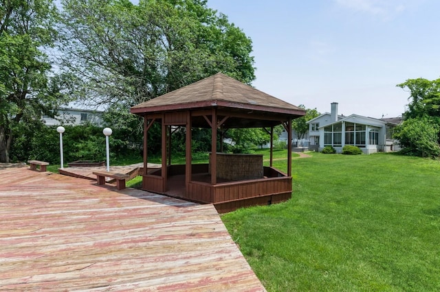 18 Oxford Rd, East Rockaway, NY 11518 - surrounding community with a gazebo, a lawn, and a wooden deck