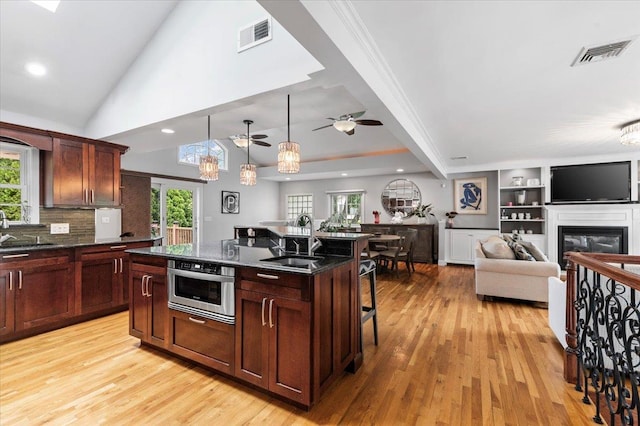 61 Beatrice Ln, Old Bethpage, NY 11804 - kitchen featuring a sink, light wood-style floors, a kitchen breakfast bar, and recessed lighting