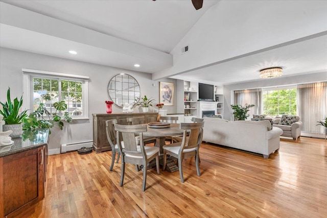 61 Beatrice Ln, Old Bethpage, NY 11804 - dining room with baseboard heating, light wood-style floors, healthy amount of natural light, a fireplace, and recessed lighting