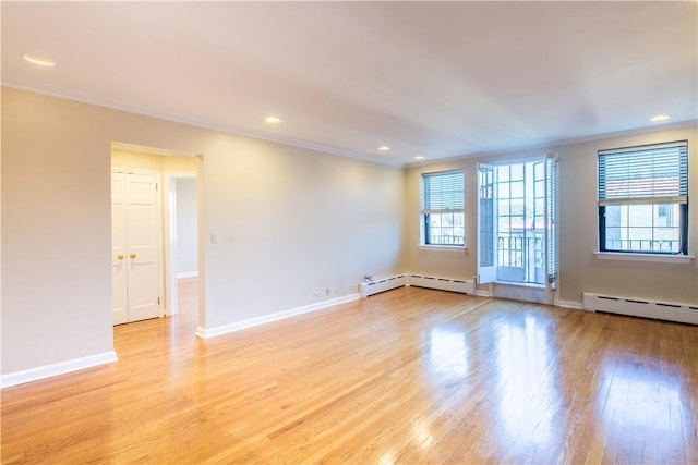 14 N Chatsworth Ave Unit 7A, Larchmont, NY 10538 - unfurnished room featuring a baseboard radiator, ornamental molding, plenty of natural light, light wood-style floors, and recessed lighting