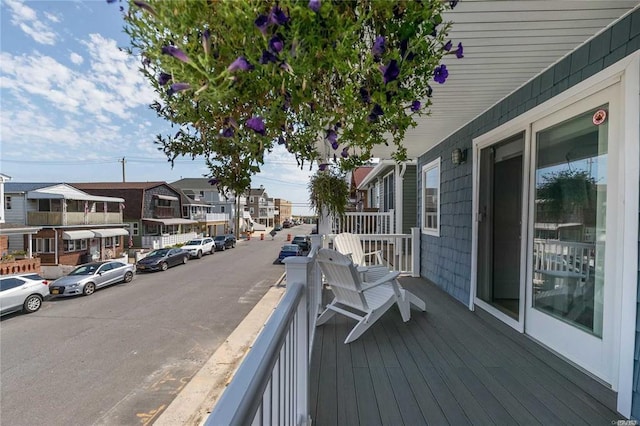 wooden terrace with a residential view