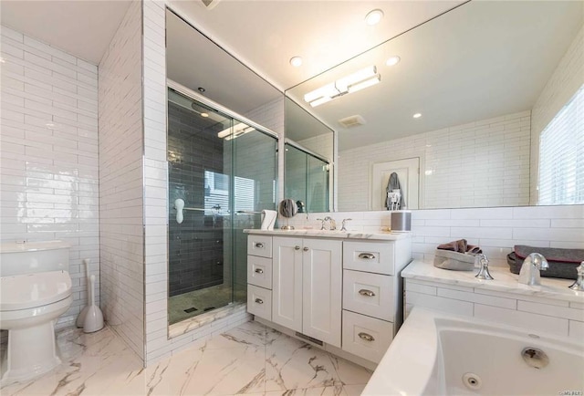 full bath with a shower stall, marble finish floor, toilet, vanity, and tile walls