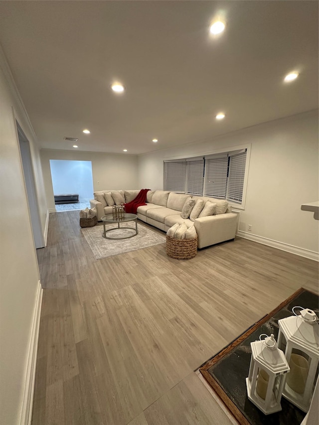 121 W Seaman Ave, Freeport, NY 11520 - living area with recessed lighting, visible vents, baseboards, and wood finished floors