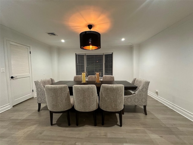 121 W Seaman Ave, Freeport, NY 11520 - dining room with visible vents, baseboards, recessed lighting, and wood finished floors