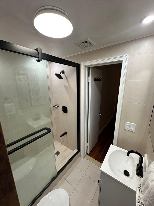 121 W Seaman Ave, Freeport, NY 11520 - full bath with a stall shower, vanity, visible vents, and tile patterned floors