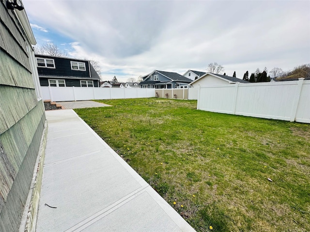 121 W Seaman Ave, Freeport, NY 11520 - view of yard featuring a patio area and a fenced backyard