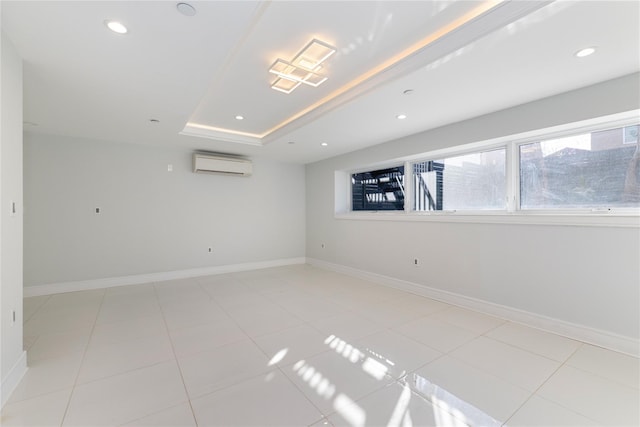 empty room with recessed lighting, an AC wall unit, and baseboards
