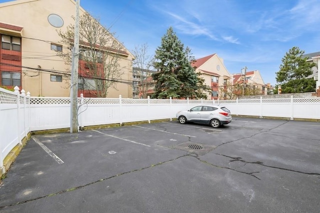 uncovered parking lot with fence
