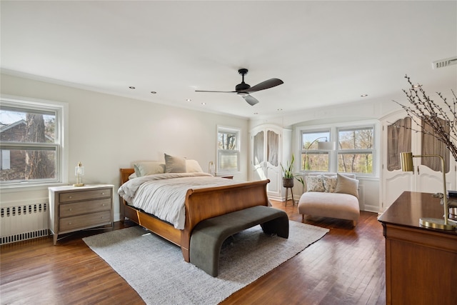 46 Wensley Dr, Great Neck, NY 11021 - bedroom with radiator, multiple windows, dark wood-style floors, recessed lighting, and ceiling fan