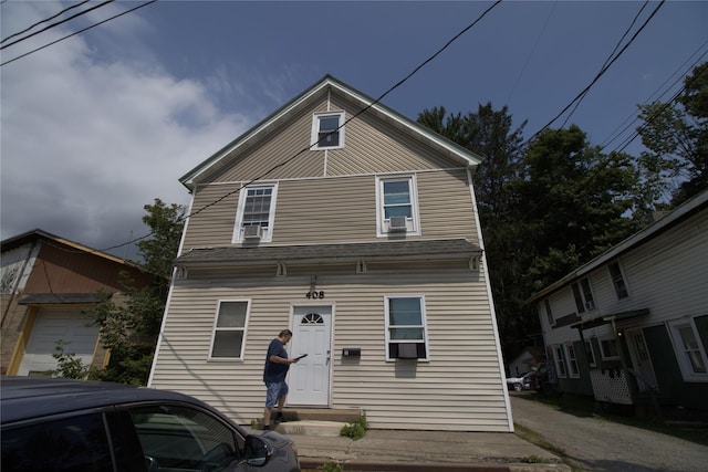 view of front of property featuring entry steps and cooling unit