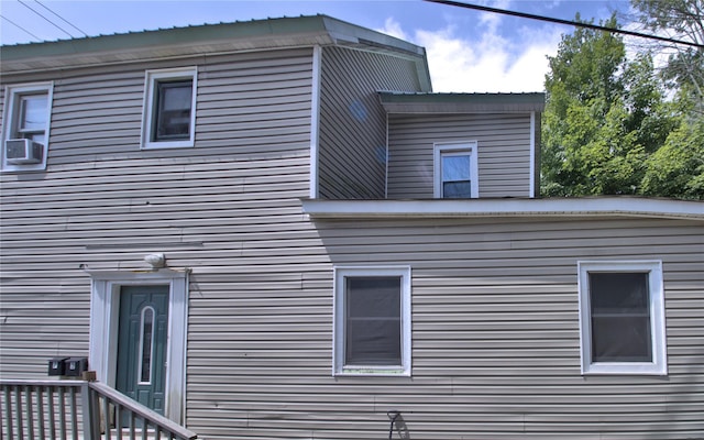 view of side of home with cooling unit