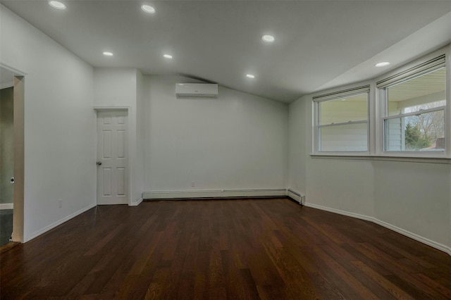 unfurnished room featuring lofted ceiling, baseboard heating, an AC wall unit, baseboards, and dark wood finished floors
