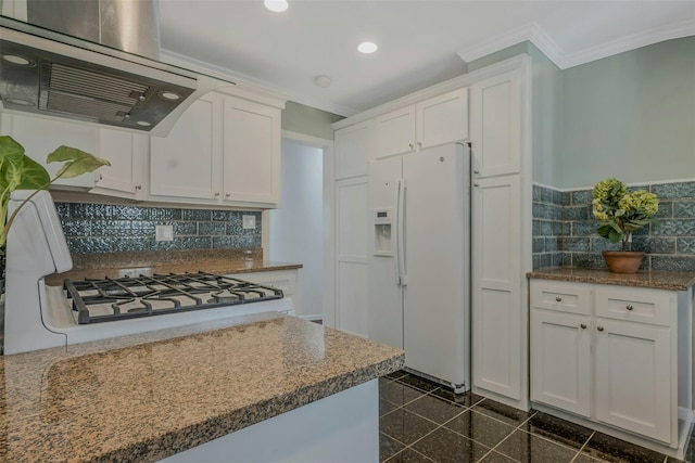 kitchen with crown molding, white fridge with ice dispenser, ventilation hood, recessed lighting, and granite finish floor