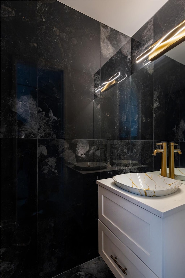 2521 Palisade Ave Unit 6A, Bronx, NY 10463 - bathroom with tile walls, vanity, and marble finish floors