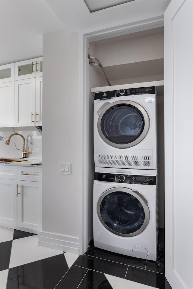 2521 Palisade Ave Unit 6A, Bronx, NY 10463 - laundry area with estacked washer and dryer and tile patterned floors