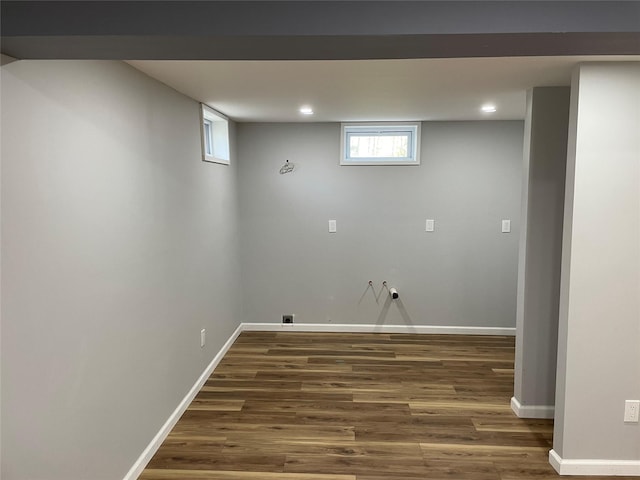 clothes washing area featuring wood finished floors, recessed lighting, and baseboards