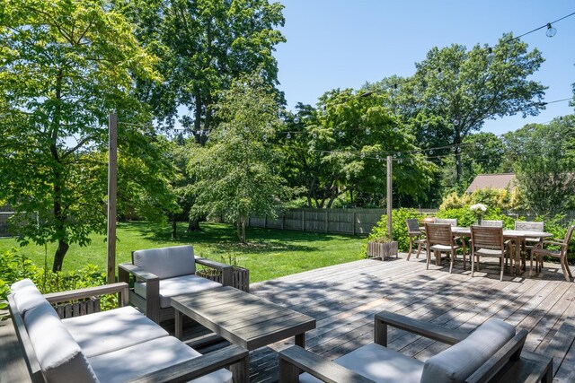 35 Turtle Cove Ln, Huntington, NY 11743 - fenced backyard featuring outdoor dining space, a wooden deck, and an outdoor hangout area
