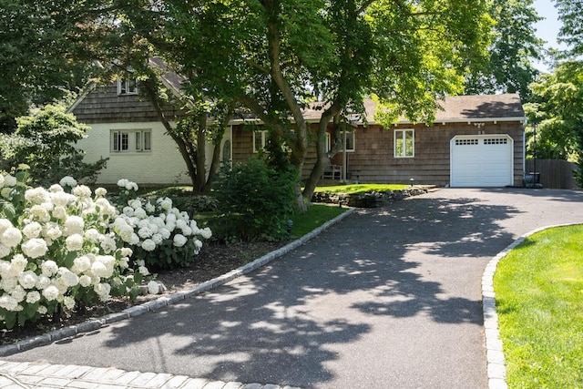 35 Turtle Cove Ln, Huntington, NY 11743 - view of front of property with an attached garage and asphalt driveway