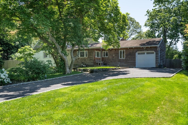 35 Turtle Cove Ln, Huntington, NY 11743 - view of front of house with an attached garage and asphalt driveway