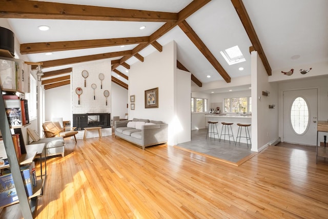 35 Turtle Cove Ln, Huntington, NY 11743 - living area featuring a skylight, a fireplace, wood finished floors, and recessed lighting