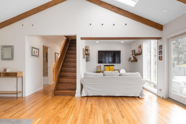 35 Turtle Cove Ln, Huntington, NY 11743 - living room featuring light wood-style floors, healthy amount of natural light, beam ceiling, stairway, and recessed lighting