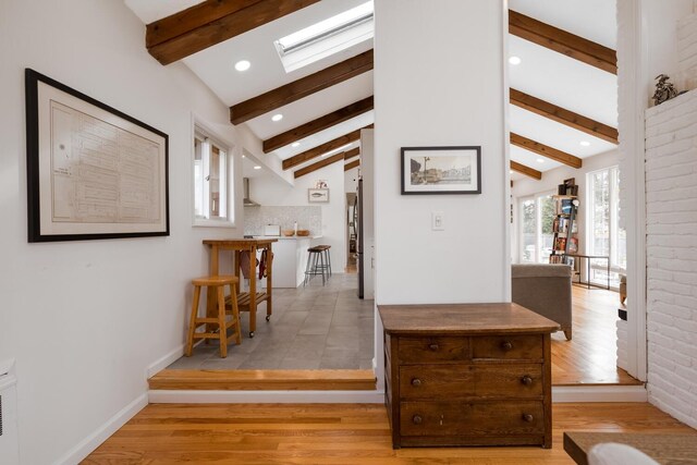 35 Turtle Cove Ln, Huntington, NY 11743 - corridor with light wood finished floors, a skylight, and recessed lighting