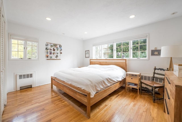 35 Turtle Cove Ln, Huntington, NY 11743 - bedroom with radiator heating unit, light wood finished floors, multiple windows, and recessed lighting
